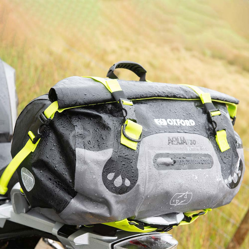 An Oxford products rollbag fitted to a motorcycle pillion seat in the rain